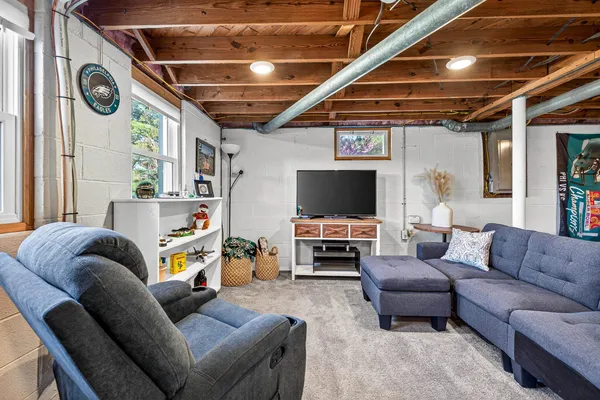 a view of a porch with chairs and backyard