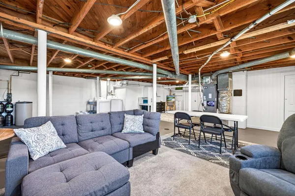 an aerial view of a tennis ground with a large tree