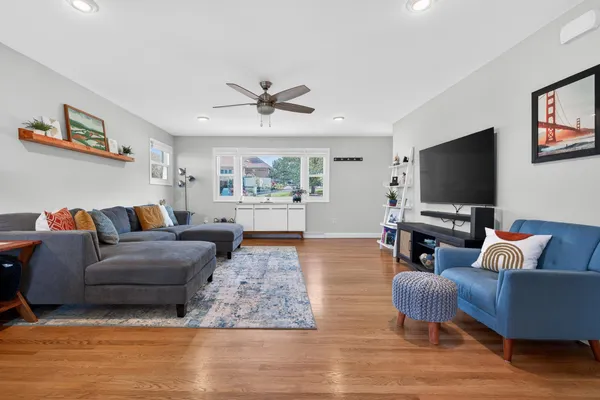 a living room with furniture and a flat screen tv