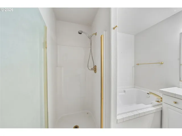 a bathroom with a bath tub and a sink