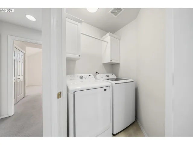 a bedroom with bed and a large mirror