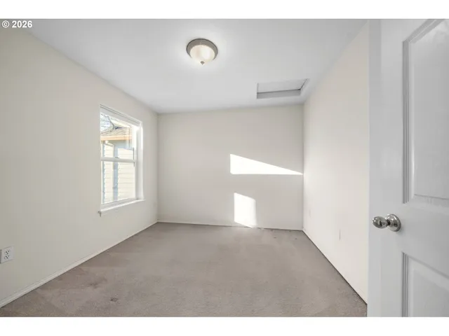 a view of an entryway with a floor to ceiling window