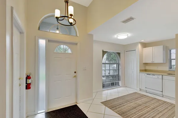 a view of a kitchen from the hallway