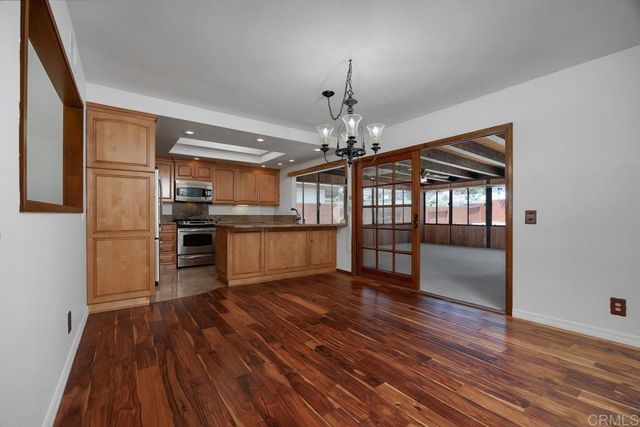 a view of a kitchen from the hallway