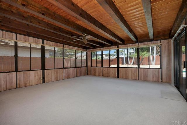 a view of an empty room with a large window