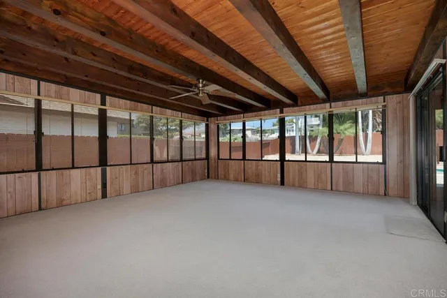 a view of an empty room with a large window