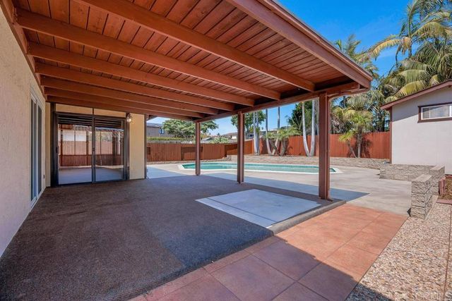 a view of a backyard of the house