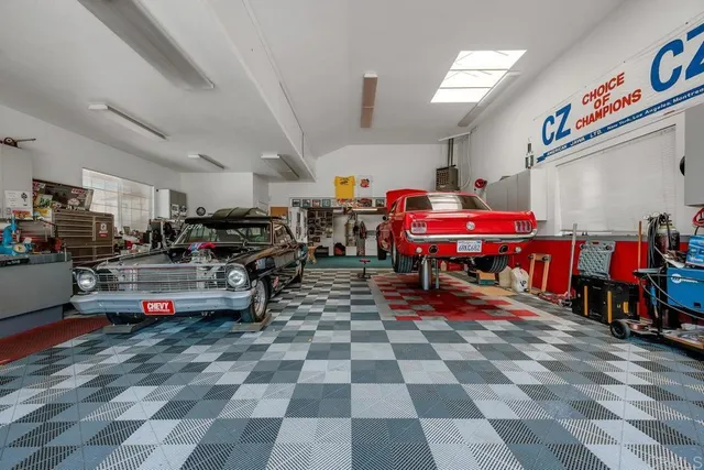 a living room with lots of furniture and cars