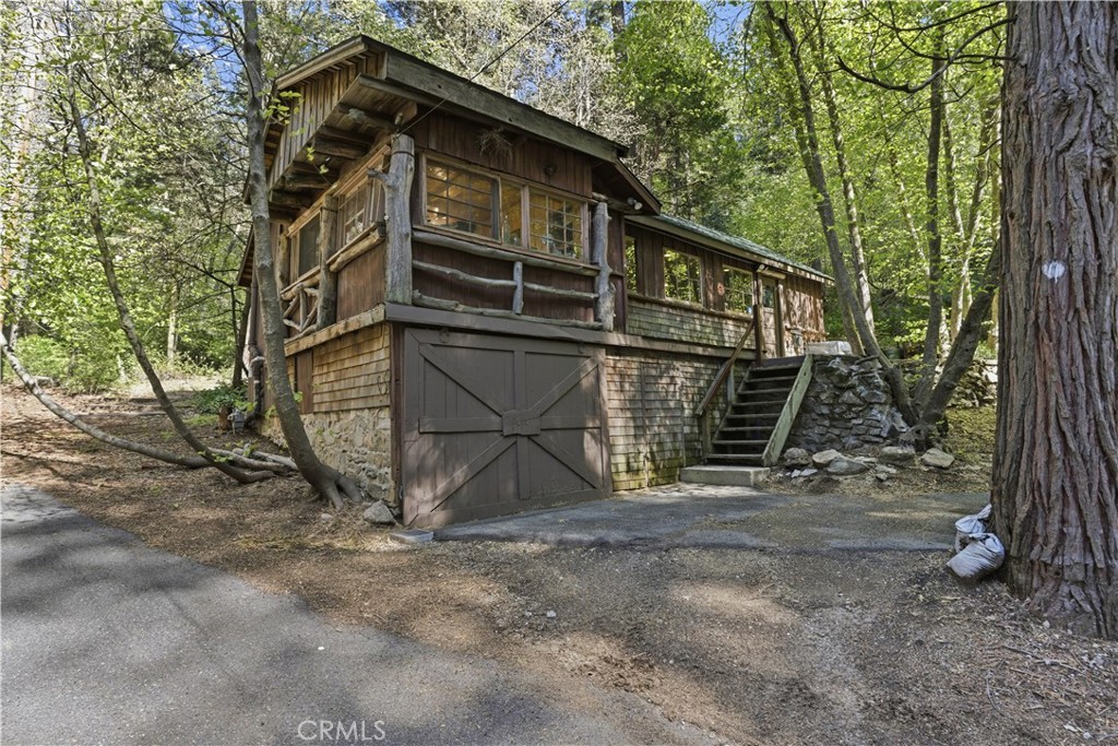 815 Cottage Grove Road Lake Arrowhead, CA 92352 - Photo 1 of 46 a view of a house with a yard