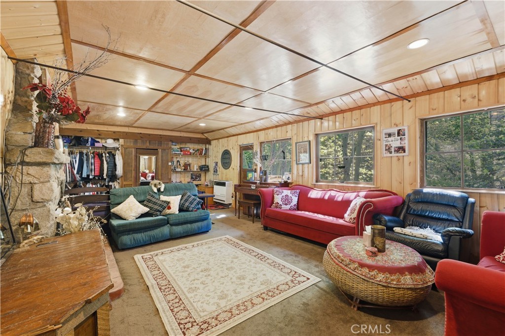 815 Cottage Grove Road Lake Arrowhead, CA 92352 - Photo 14 of 46 a living room with furniture and a large window