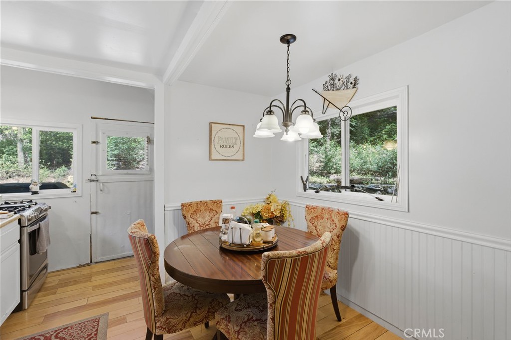 815 Cottage Grove Road Lake Arrowhead, CA 92352 - Photo 21 of 46 a view of a dining room with furniture window and outside view
