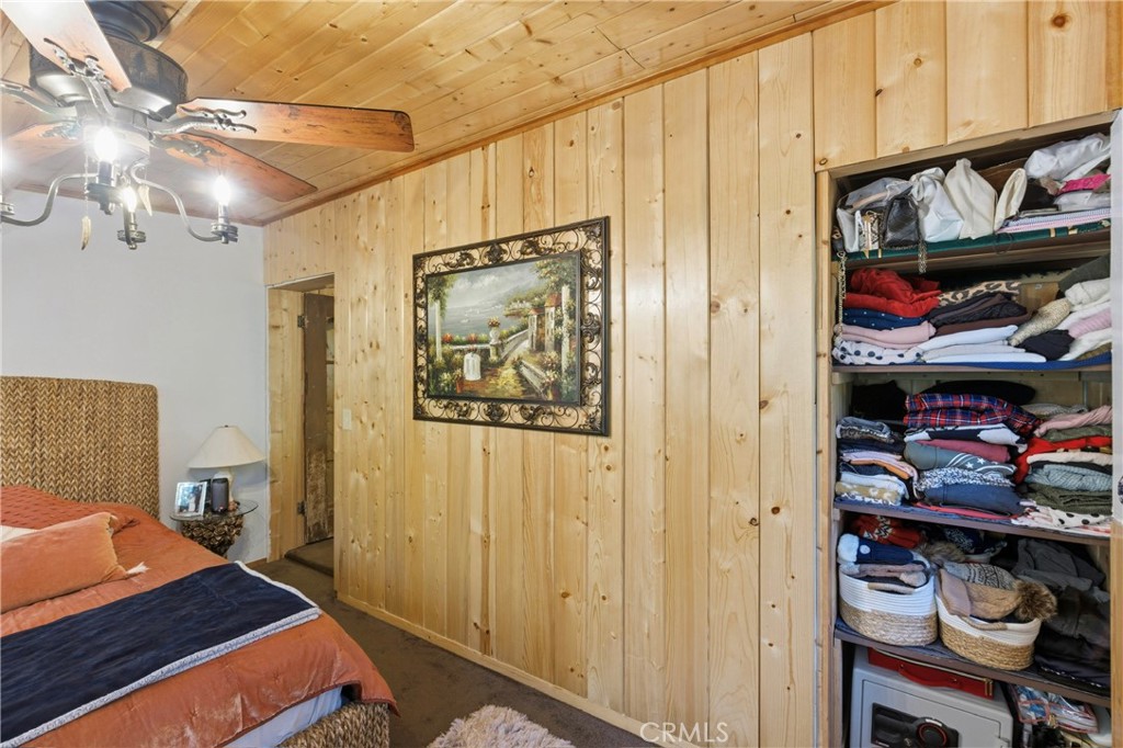 815 Cottage Grove Road Lake Arrowhead, CA 92352 - Photo 31 of 46 a bedroom with a bed and a closet