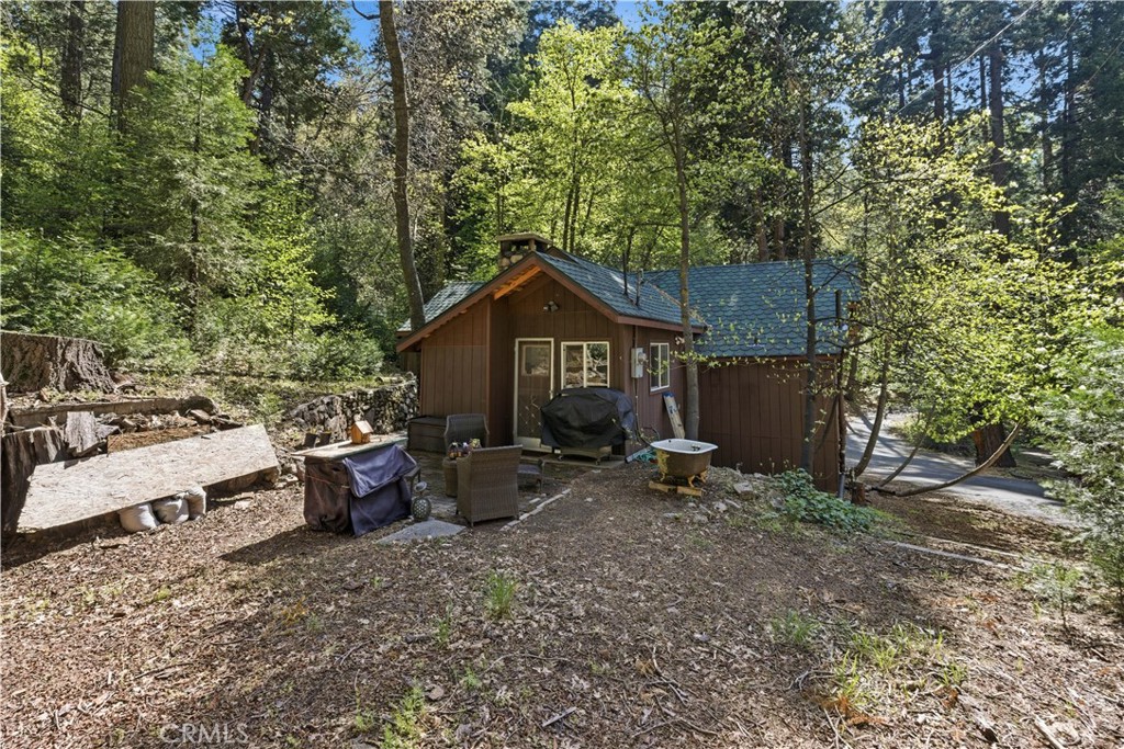 815 Cottage Grove Road Lake Arrowhead, CA 92352 - Photo 39 of 46 a view of house with backyard and seating area