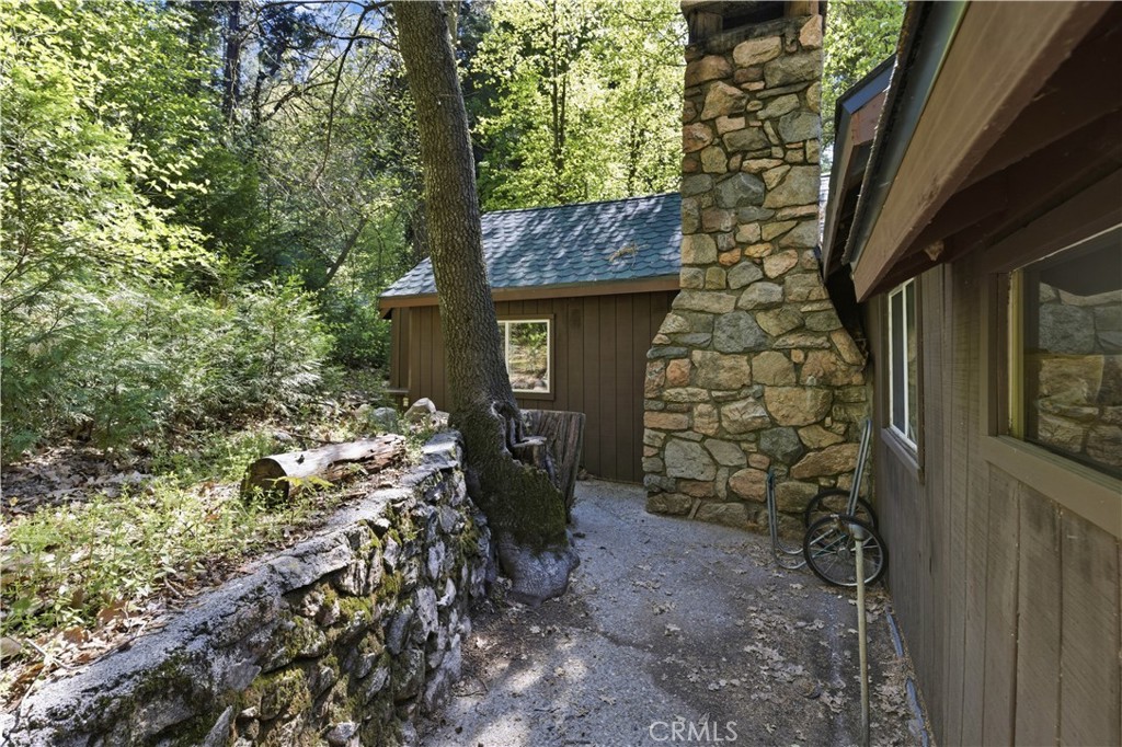 815 Cottage Grove Road Lake Arrowhead, CA 92352 - Photo 41 of 46 a brick building with a tree in front of it