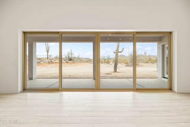 a kitchen with kitchen island granite countertop a sink stove and refrigerator