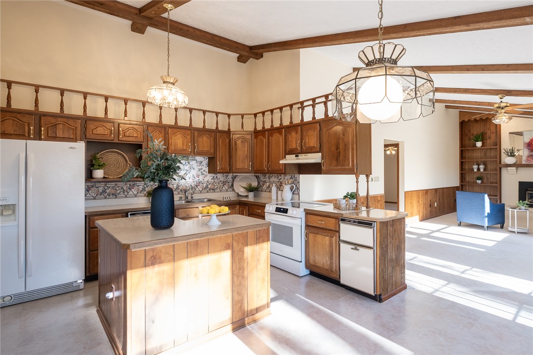 276 South Fairfield Road Bellbrook, OH 45305 - Photo 9 of 38 This spacious kitchen offers a functional layout with ample cabinet space, seamlessly connecting to the living area.