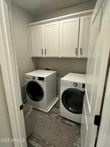 a utility room with a sink a washer and dryer