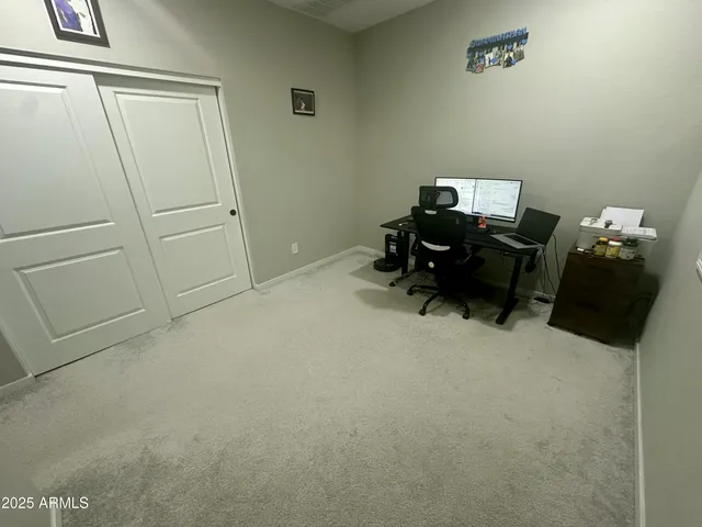 a bed room with a bed and a chair