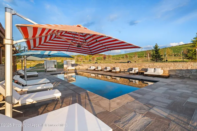 a view of a chairs and table in patio