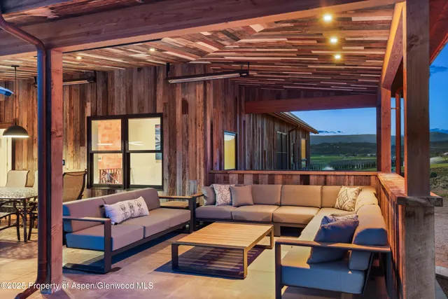 a kitchen with stainless steel appliances a stove a sink dishwasher and white cabinets with wooden floor