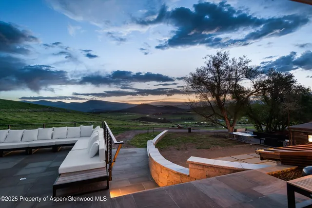 a kitchen with stainless steel appliances a stove a sink and a refrigerator