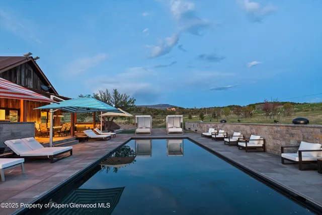 a view of a dining room with furniture and a fireplace