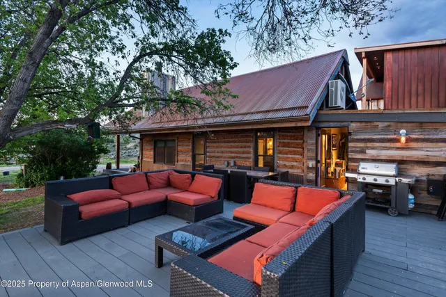 a bedroom with a bed and a television