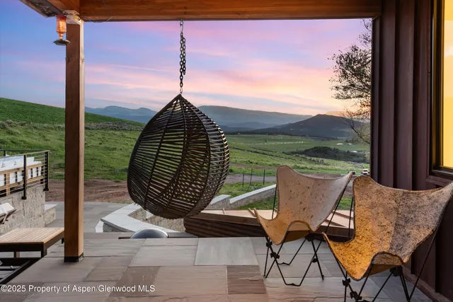 a kitchen with stainless steel appliances kitchen island granite countertop a refrigerator and a stove top oven