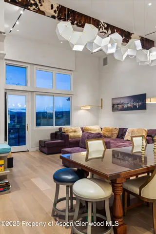 a kitchen with a sink cabinets and wooden floor
