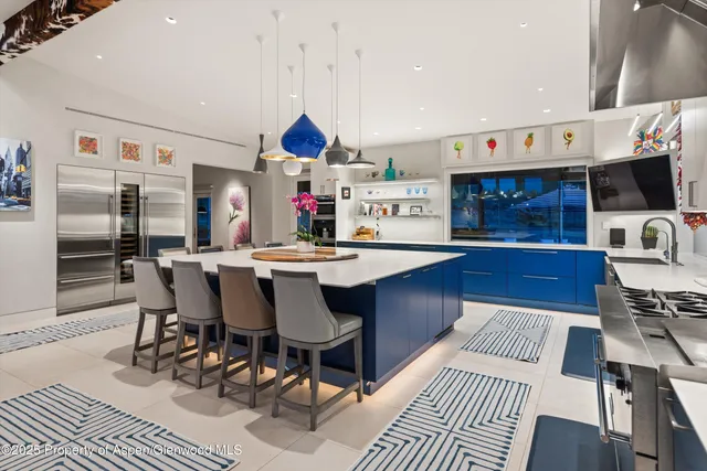 a view of washer and dryer with kitchen in the background