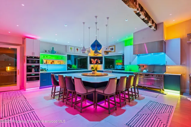 a room with gym equipment and a wooden floor