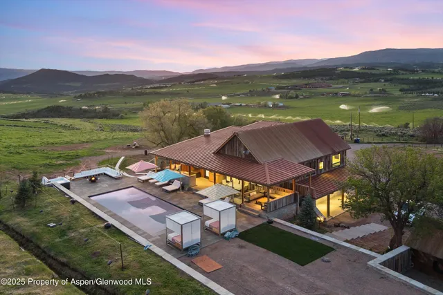 a view of swimming pool with outdoor seating