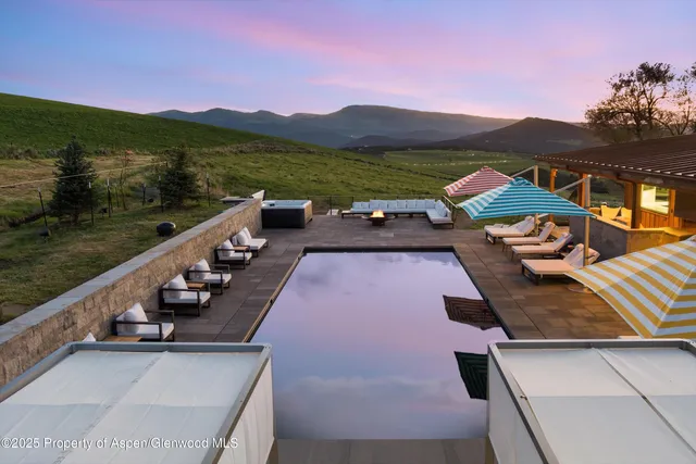 a outdoor living space with furniture and a fireplace