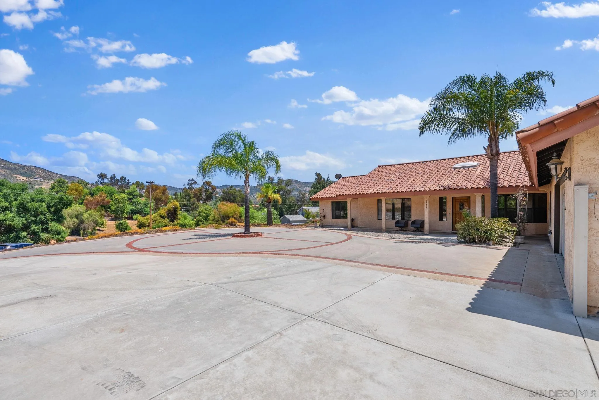 3290 Quail Way Jamul, CA 91935 - Photo 12 of 73 a front view of house with yard and green space