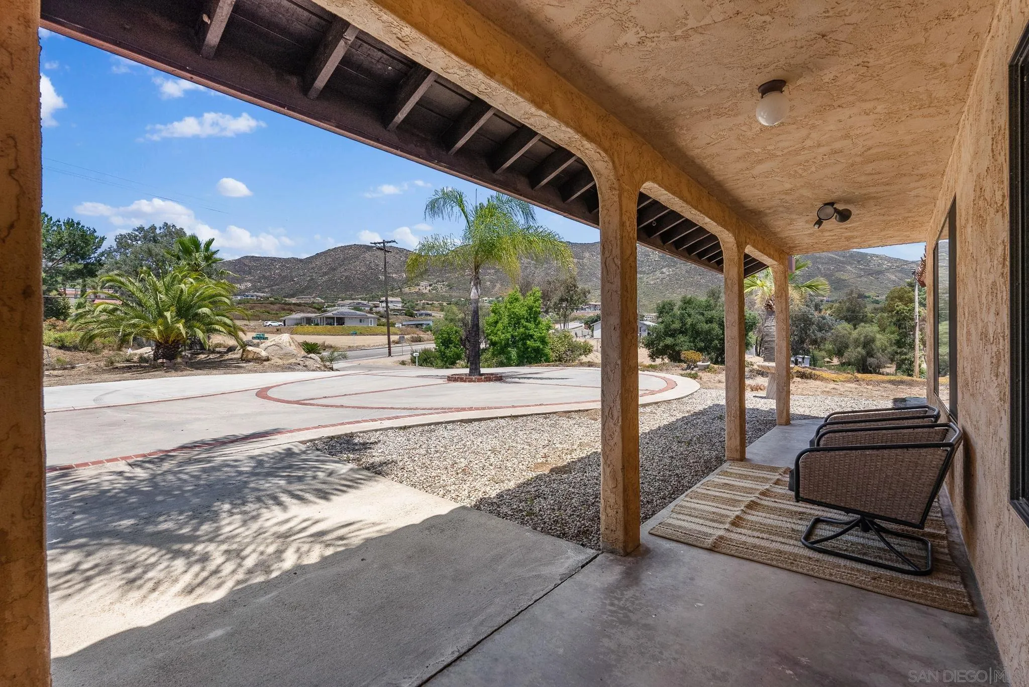 3290 Quail Way Jamul, CA 91935 - Photo 13 of 73 a view of balcony with couch and wooden fence