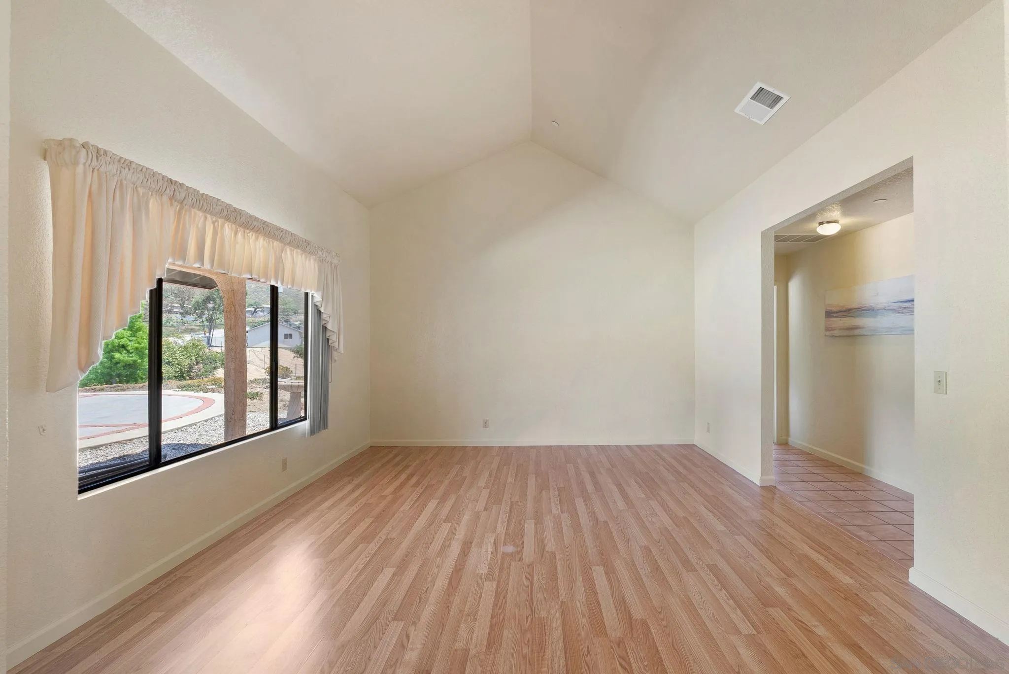 3290 Quail Way Jamul, CA 91935 - Photo 18 of 73 wooden floor in an empty room with a window