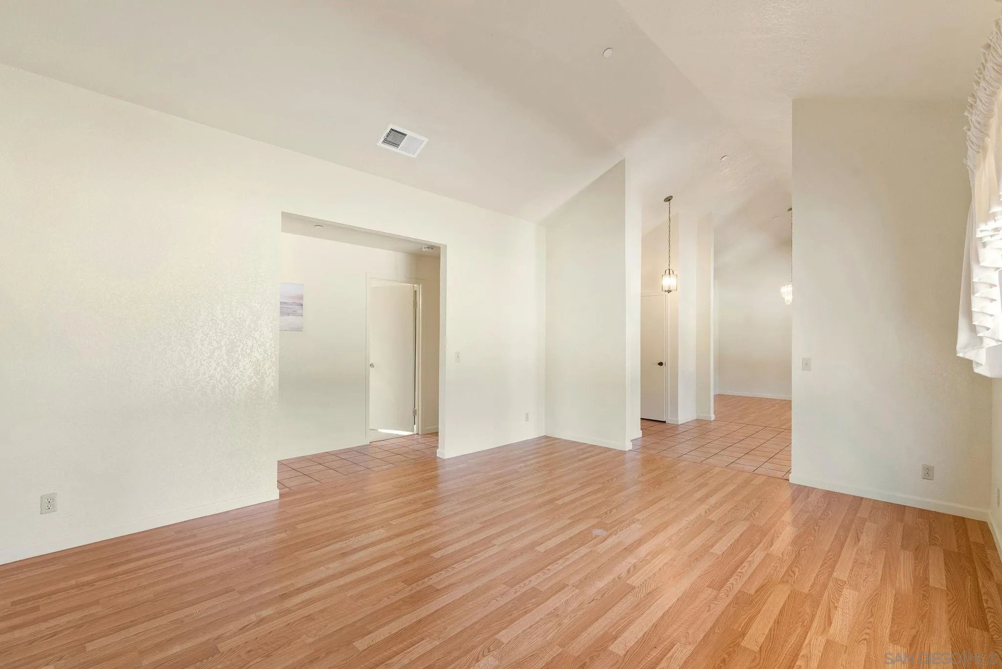 3290 Quail Way Jamul, CA 91935 - Photo 20 of 73 a view of a big room with wooden floor and windows