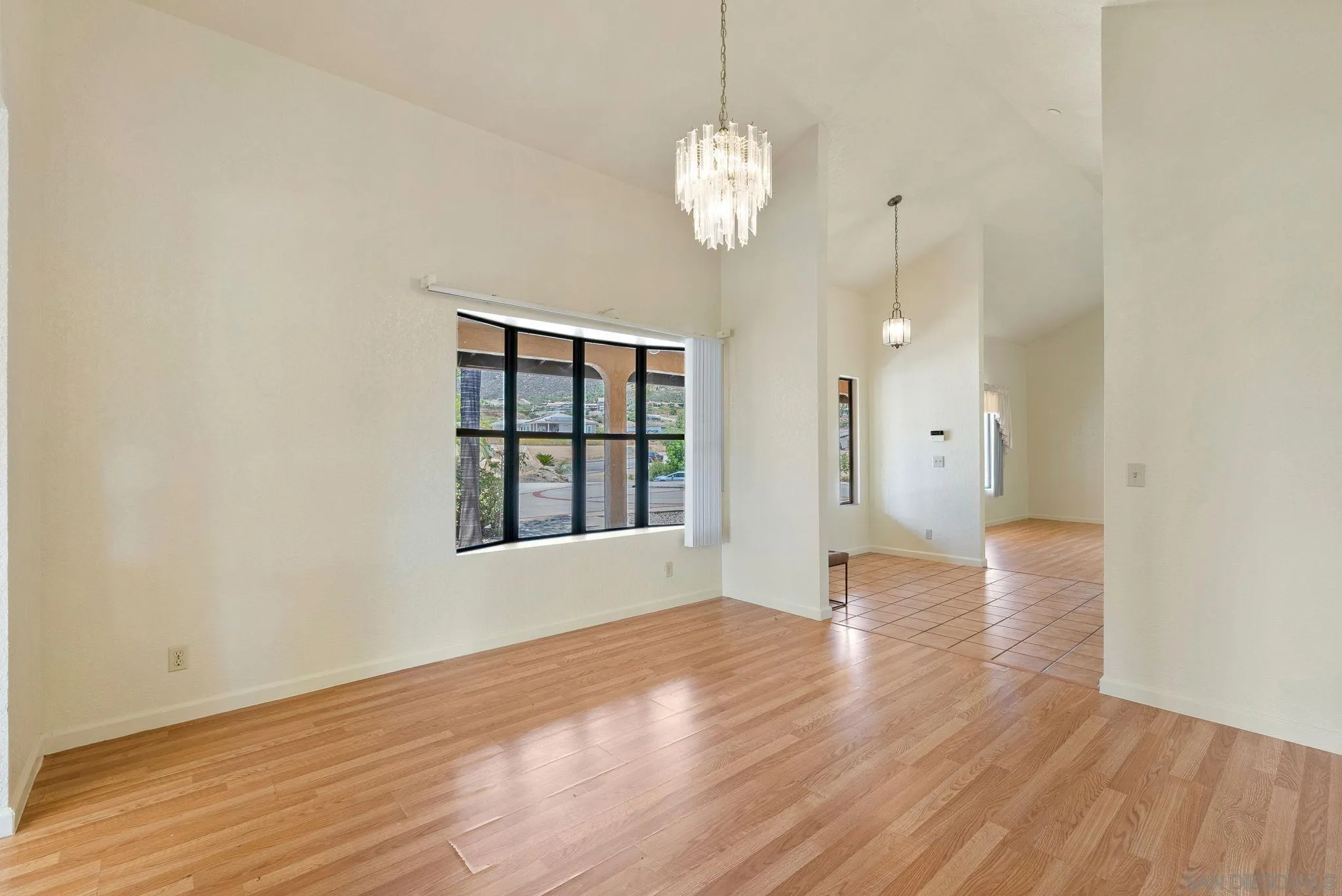 3290 Quail Way Jamul, CA 91935 - Photo 23 of 73 a view of an empty room with wooden floor and a window
