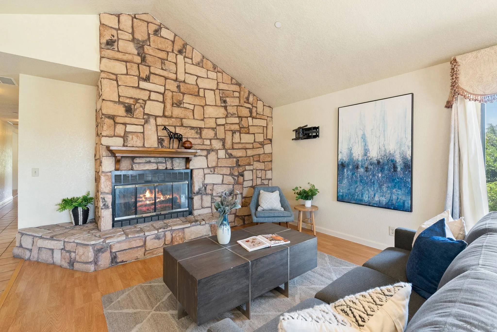 3290 Quail Way Jamul, CA 91935 - Photo 35 of 73 a living room with furniture and a fireplace