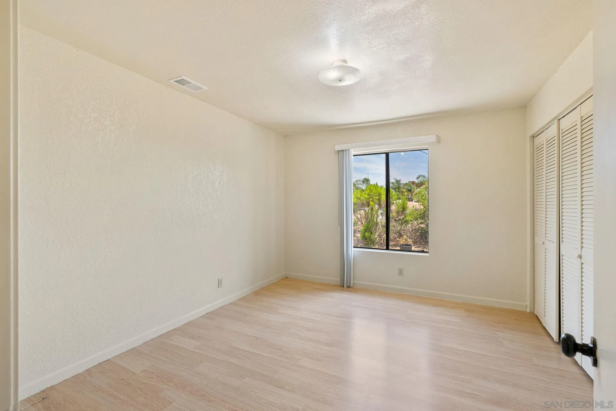 3290 Quail Way Jamul, CA 91935 - Photo 37 of 73 an empty room with a window