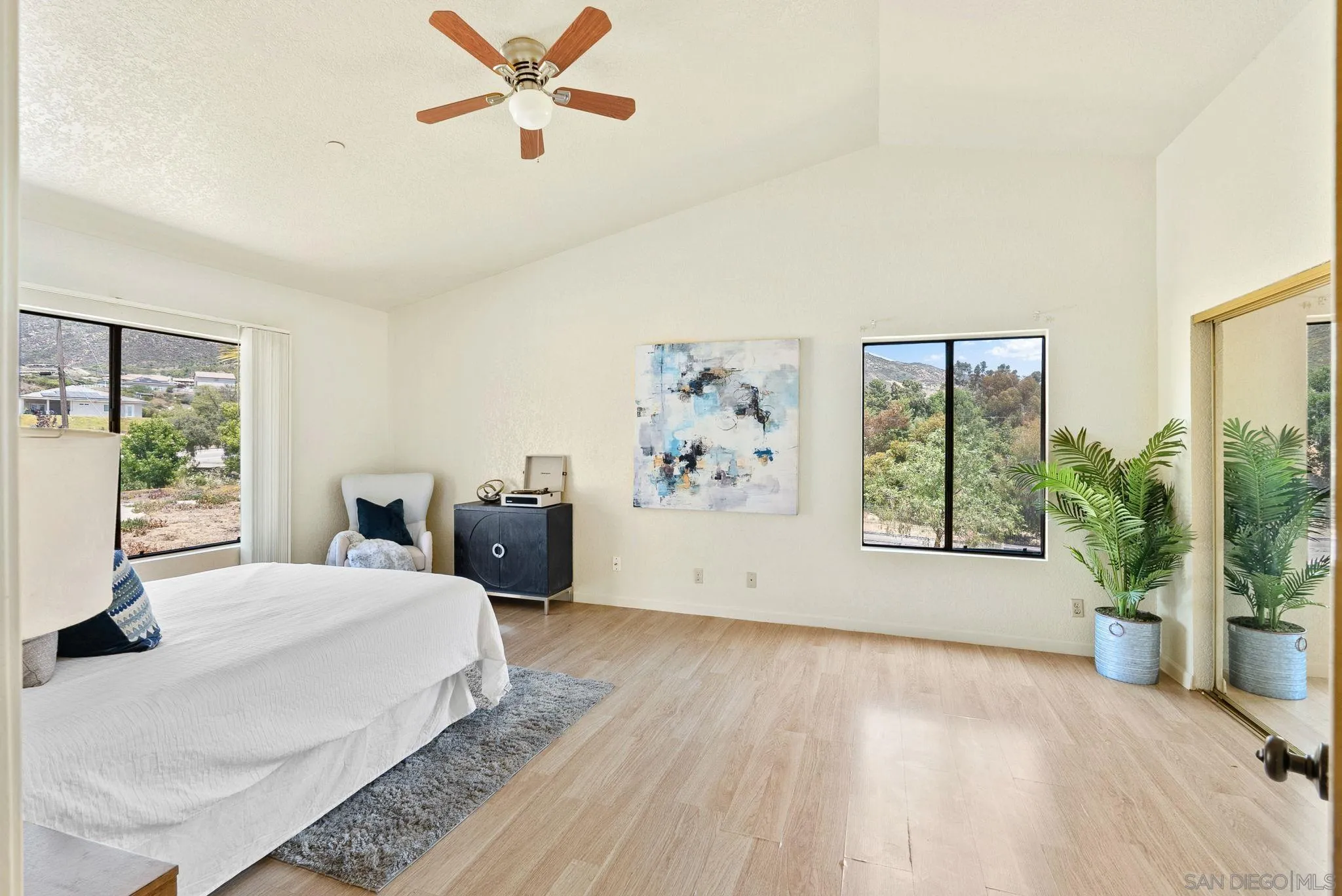 3290 Quail Way Jamul, CA 91935 - Photo 42 of 73 a spacious bedroom with a large bed and a window
