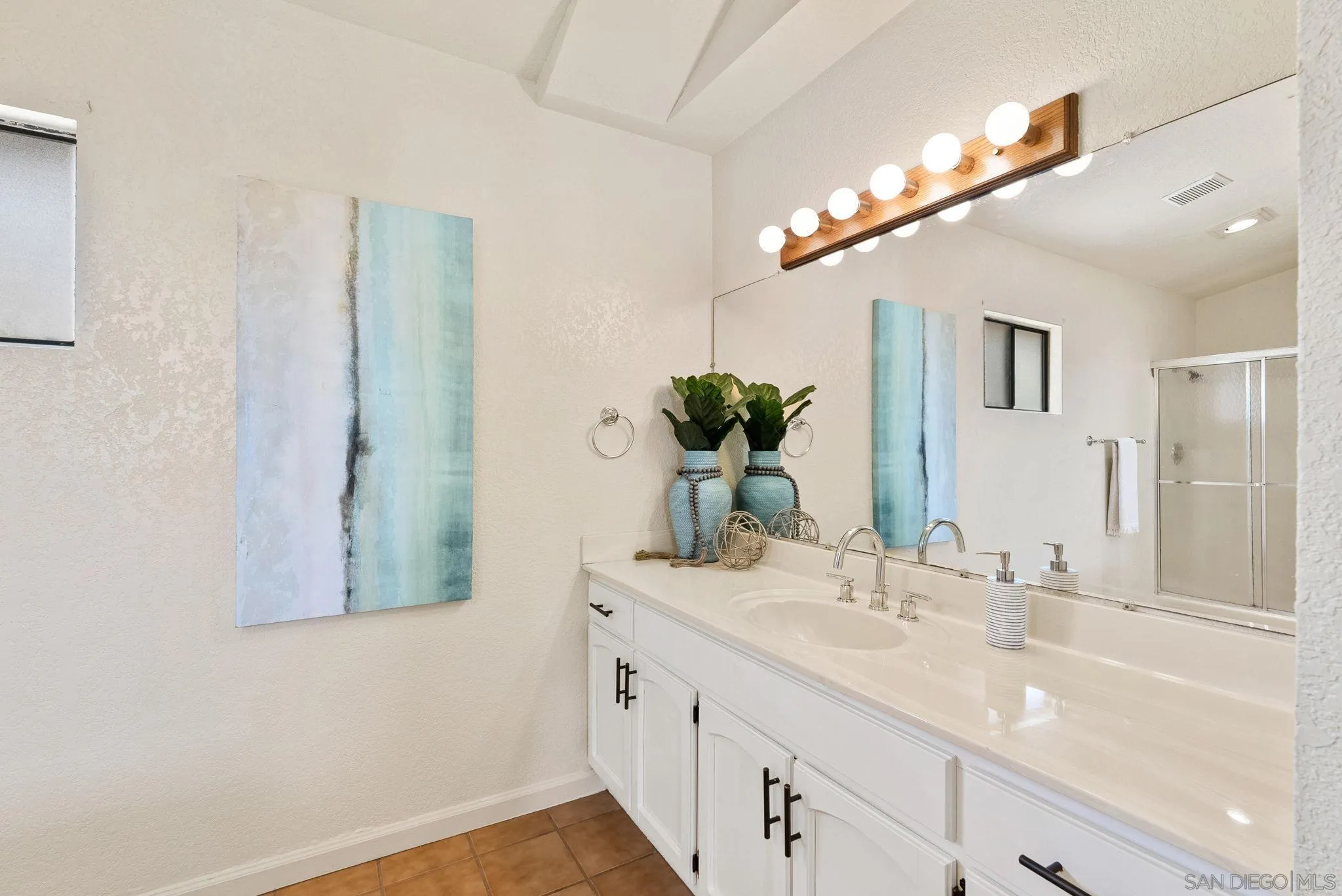 3290 Quail Way Jamul, CA 91935 - Photo 45 of 73 a bathroom with a double vanity sink and a mirror