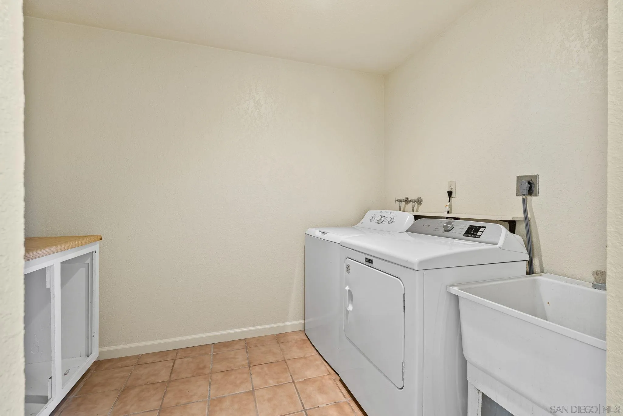 3290 Quail Way Jamul, CA 91935 - Photo 48 of 73 a utility room with dryer and washer