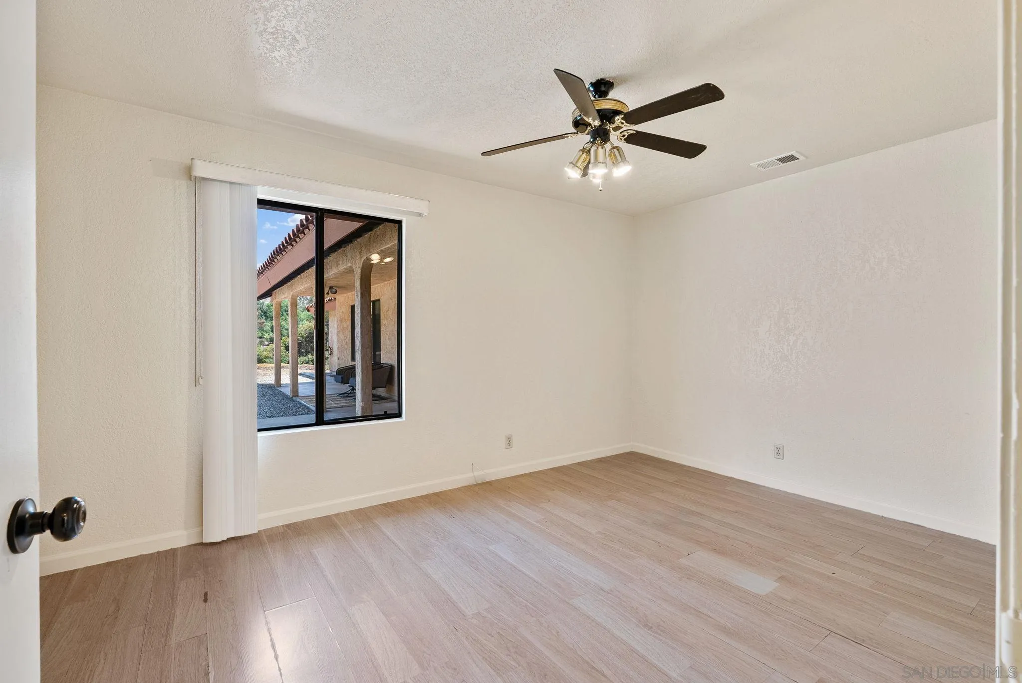 3290 Quail Way Jamul, CA 91935 - Photo 49 of 73 wooden floor in an empty room with a window