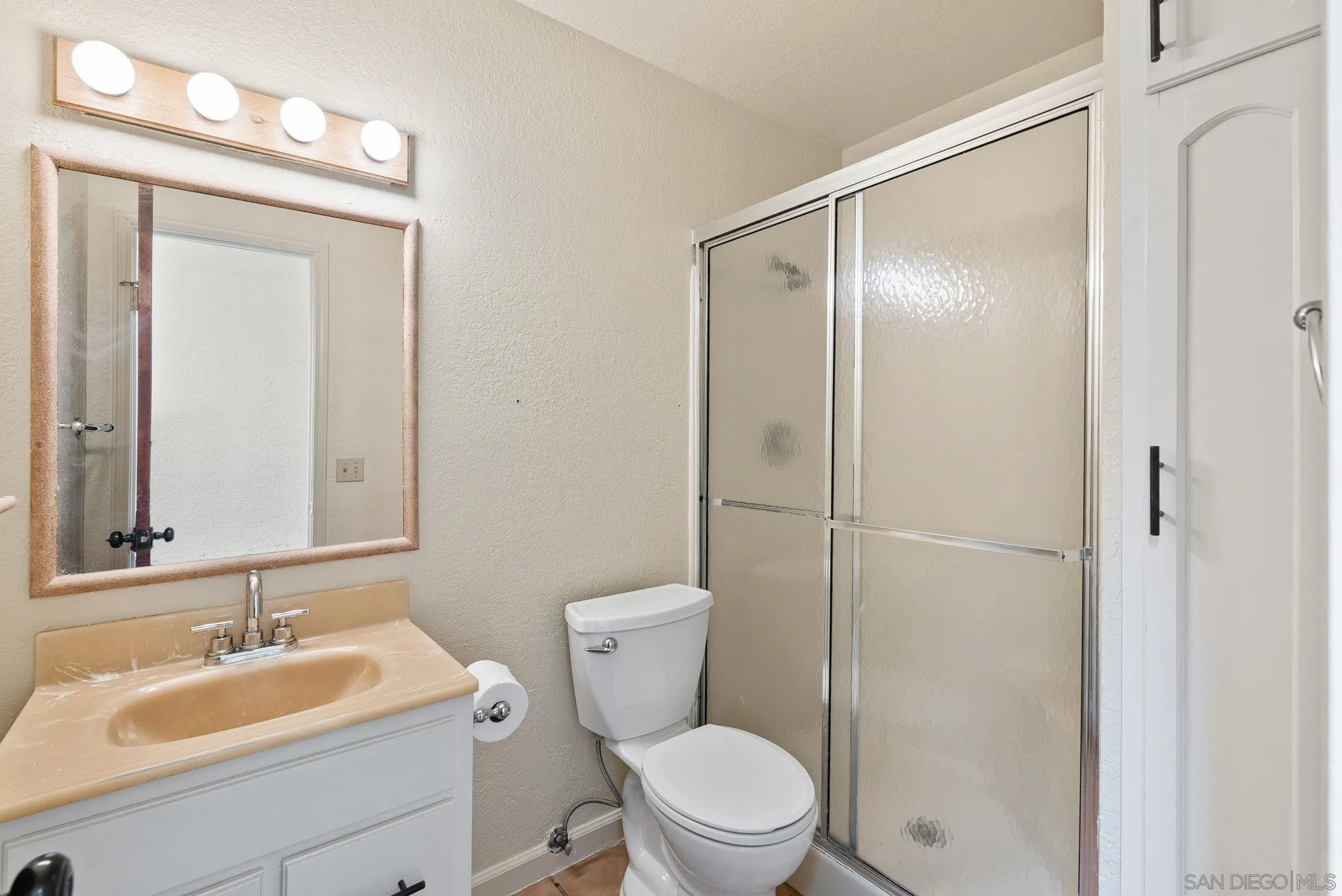 3290 Quail Way Jamul, CA 91935 - Photo 50 of 73 a bathroom with a toilet a sink and a mirror