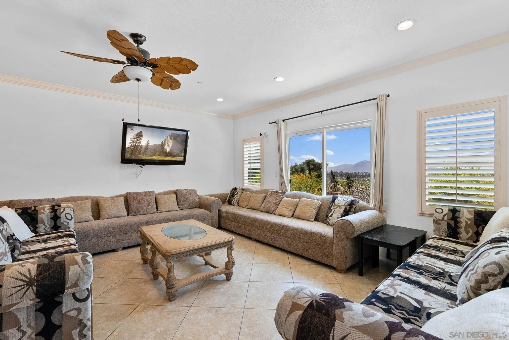 3290 Quail Way Jamul, CA 91935 - Photo 56 of 73 a living room with furniture ceiling fan and a large window