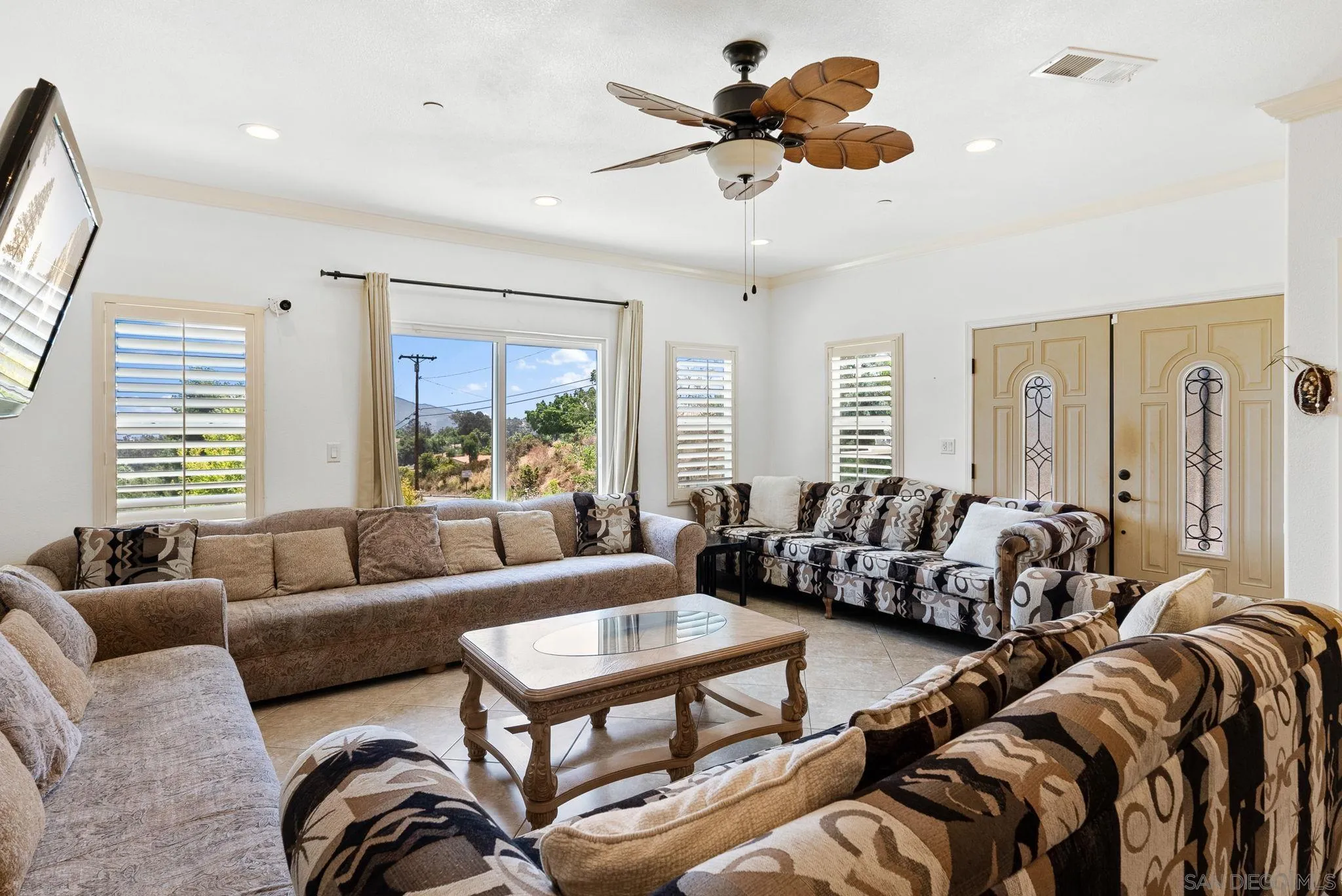 3290 Quail Way Jamul, CA 91935 - Photo 57 of 73 a living room with furniture ceiling fan and a window