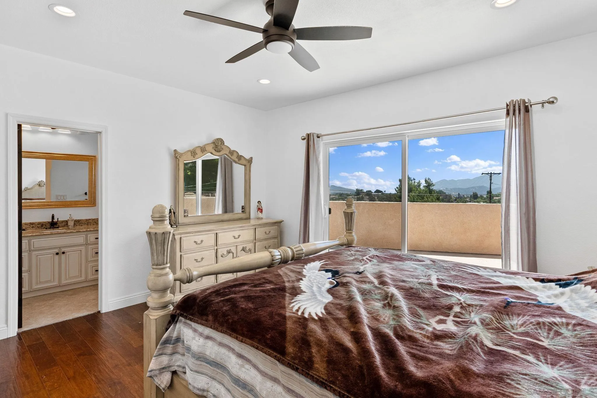 3290 Quail Way Jamul, CA 91935 - Photo 69 of 73 a bedroom with a large bed and a window