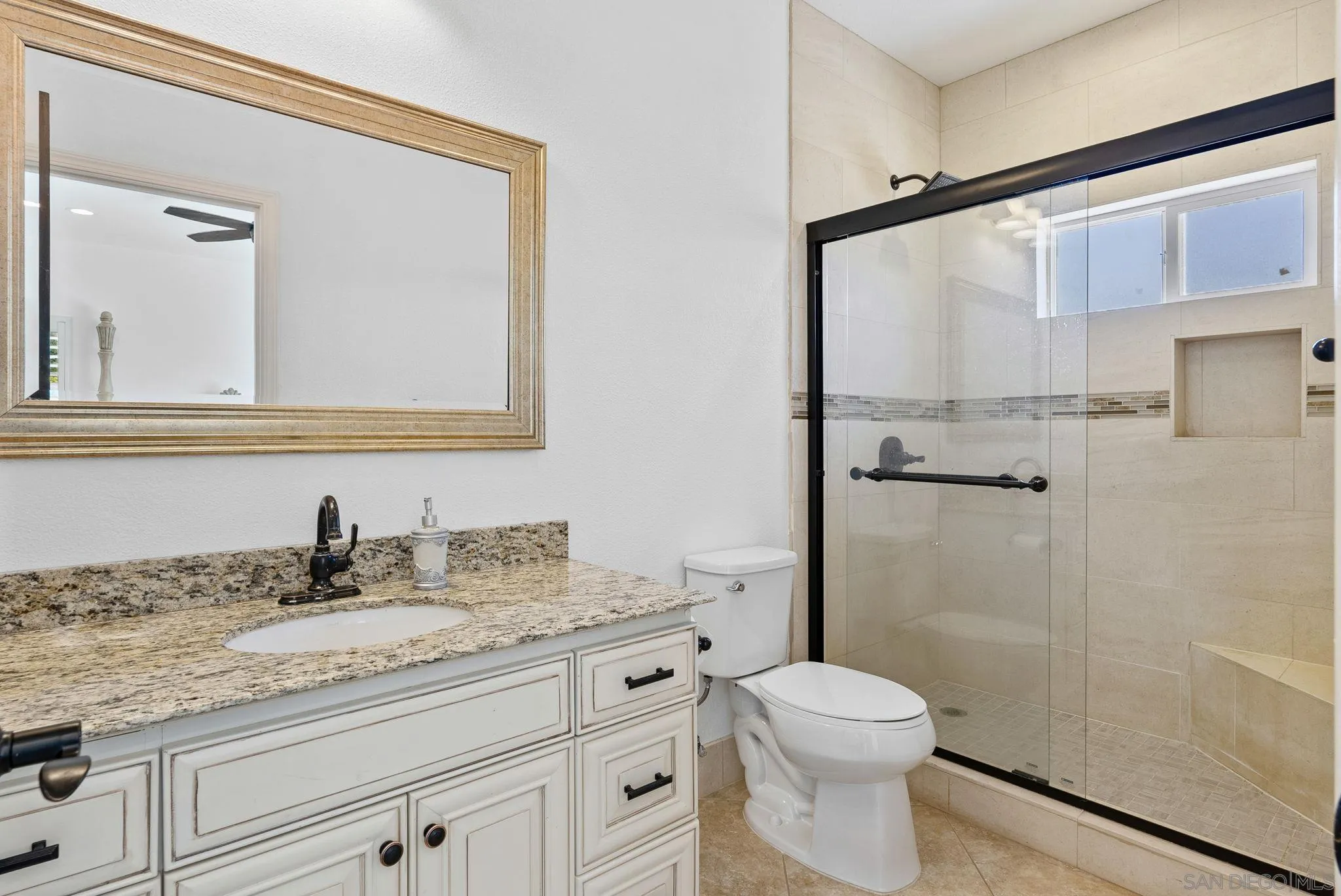 3290 Quail Way Jamul, CA 91935 - Photo 70 of 73 a bathroom with a granite countertop sink a toilet and shower