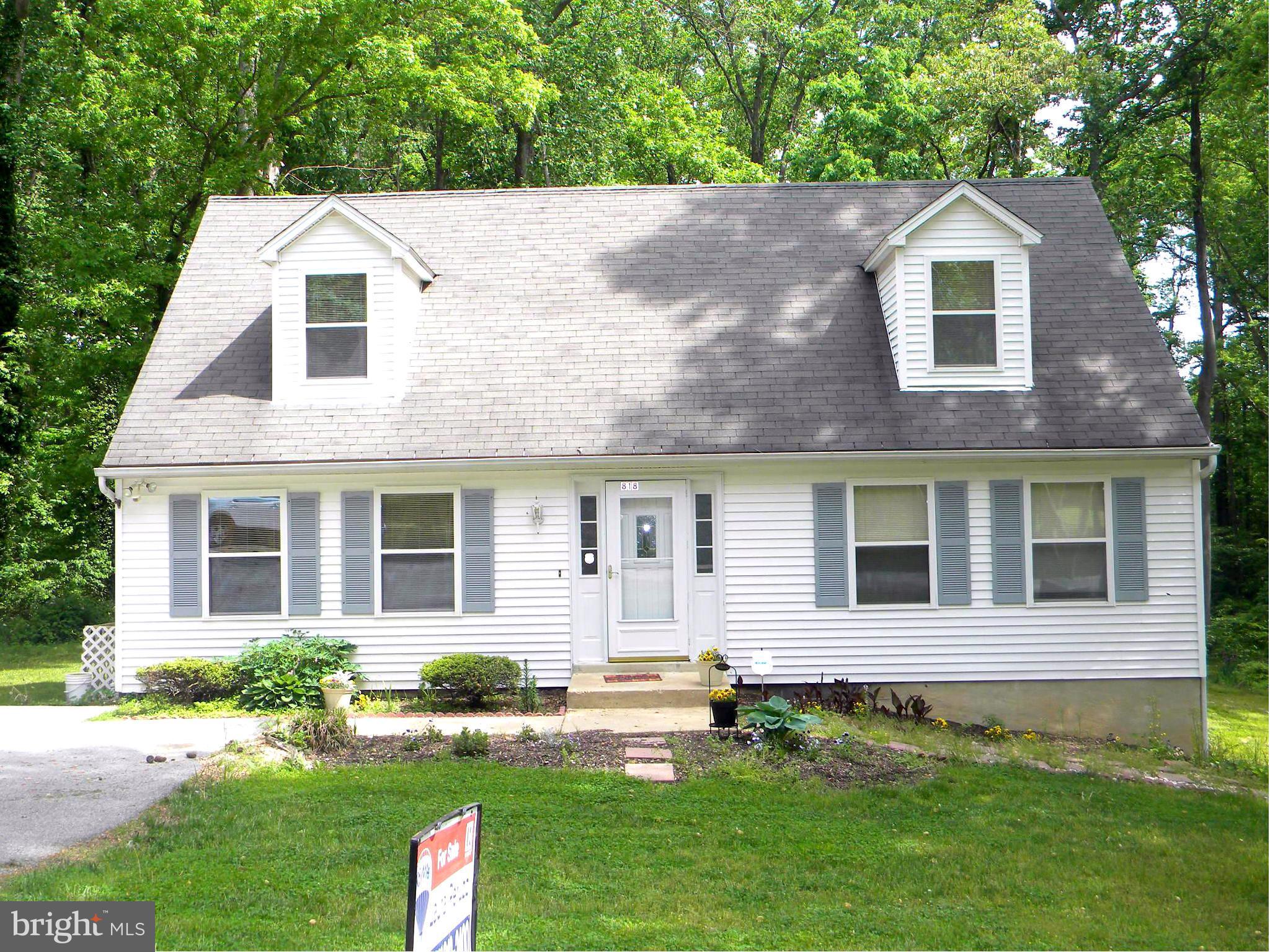 818 Ridge Court Lusby, MD 20657 - Photo 1 of 18 a front view of a house with a yard
